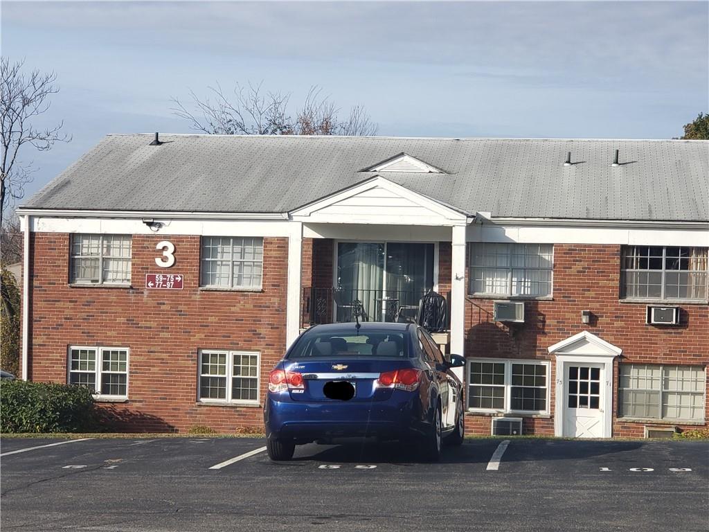 3 Colonial Road, Unit 85 Beacon, NY 12508 - Photo 1 of 1 a front view of a house with parking space and windows