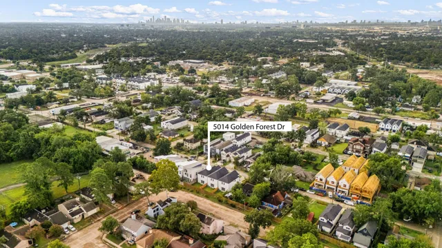 an aerial view of residential building with parking and parking space