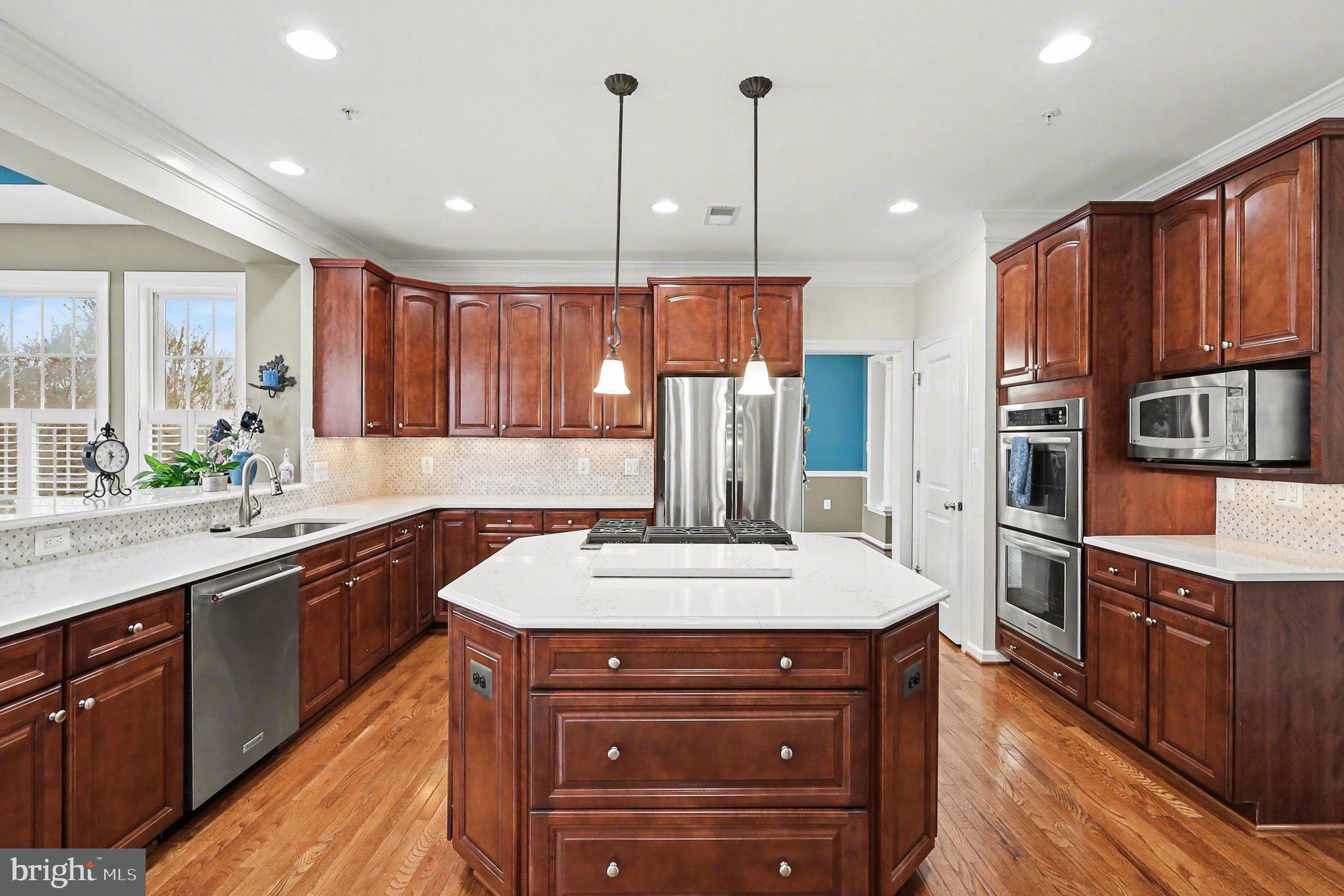 13212 Moonlight Trail Drive Silver Spring, MD 20906 - Photo 17 of 81 a kitchen with stainless steel appliances granite countertop a sink stove and refrigerator