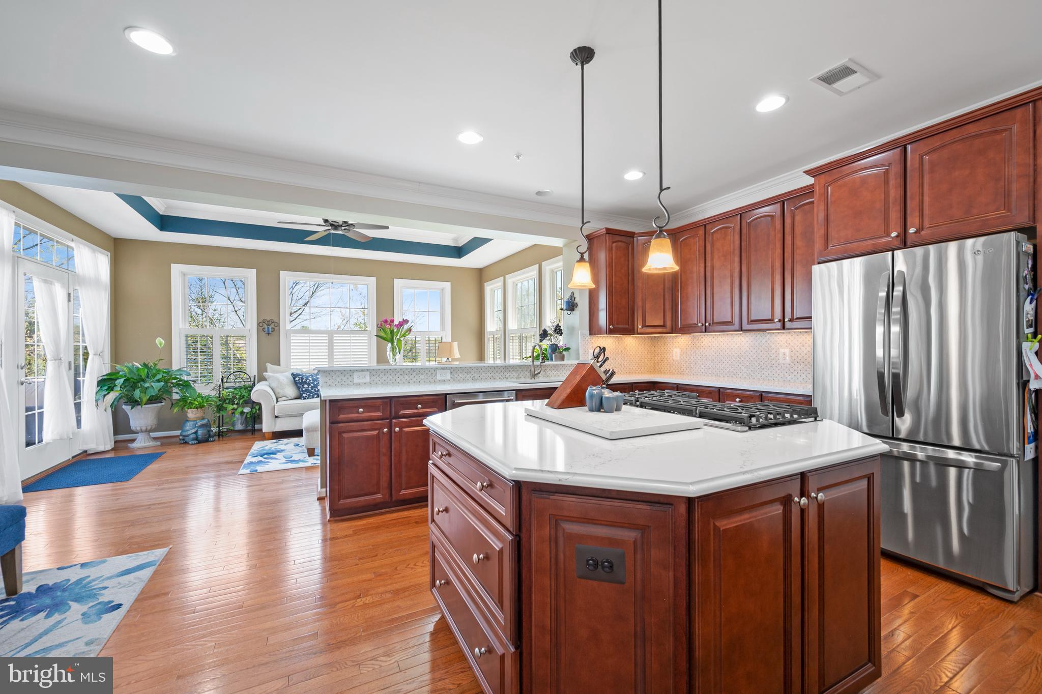 13212 Moonlight Trail Drive Silver Spring, MD 20906 - Photo 19 of 81 a kitchen with stainless steel appliances granite countertop hardwood floor sink stove large window and wooden floor