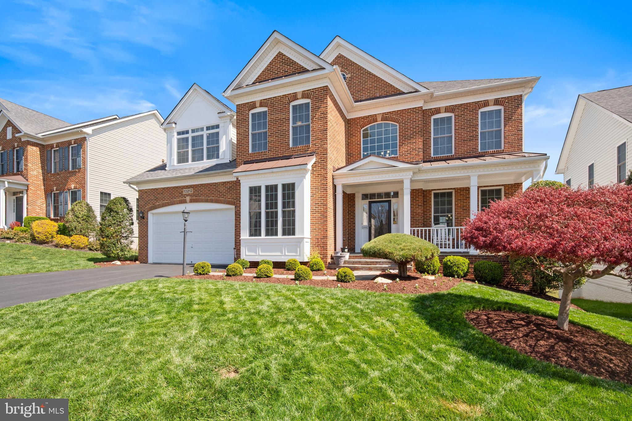 13212 Moonlight Trail Drive Silver Spring, MD 20906 - Photo 2 of 81 a front view of a house with garden and trees