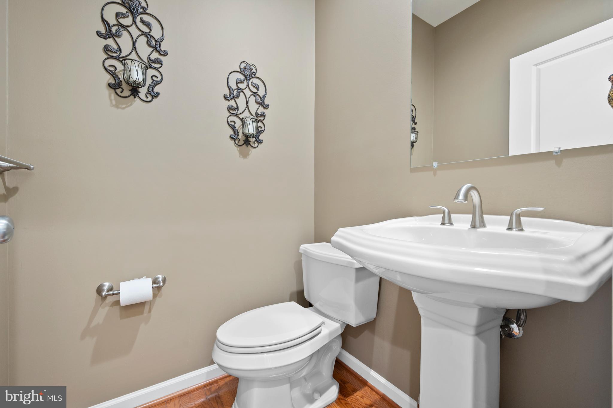 13212 Moonlight Trail Drive Silver Spring, MD 20906 - Photo 28 of 81 a bathroom with a sink a toilet and mirror