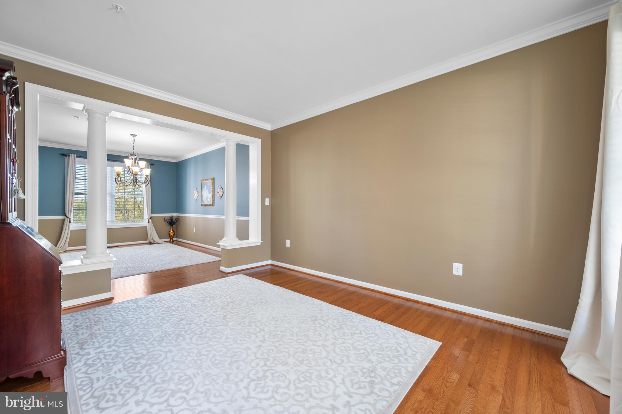 13212 Moonlight Trail Drive Silver Spring, MD 20906 - Photo 33 of 81 a view of an empty room with wooden floor and a large window