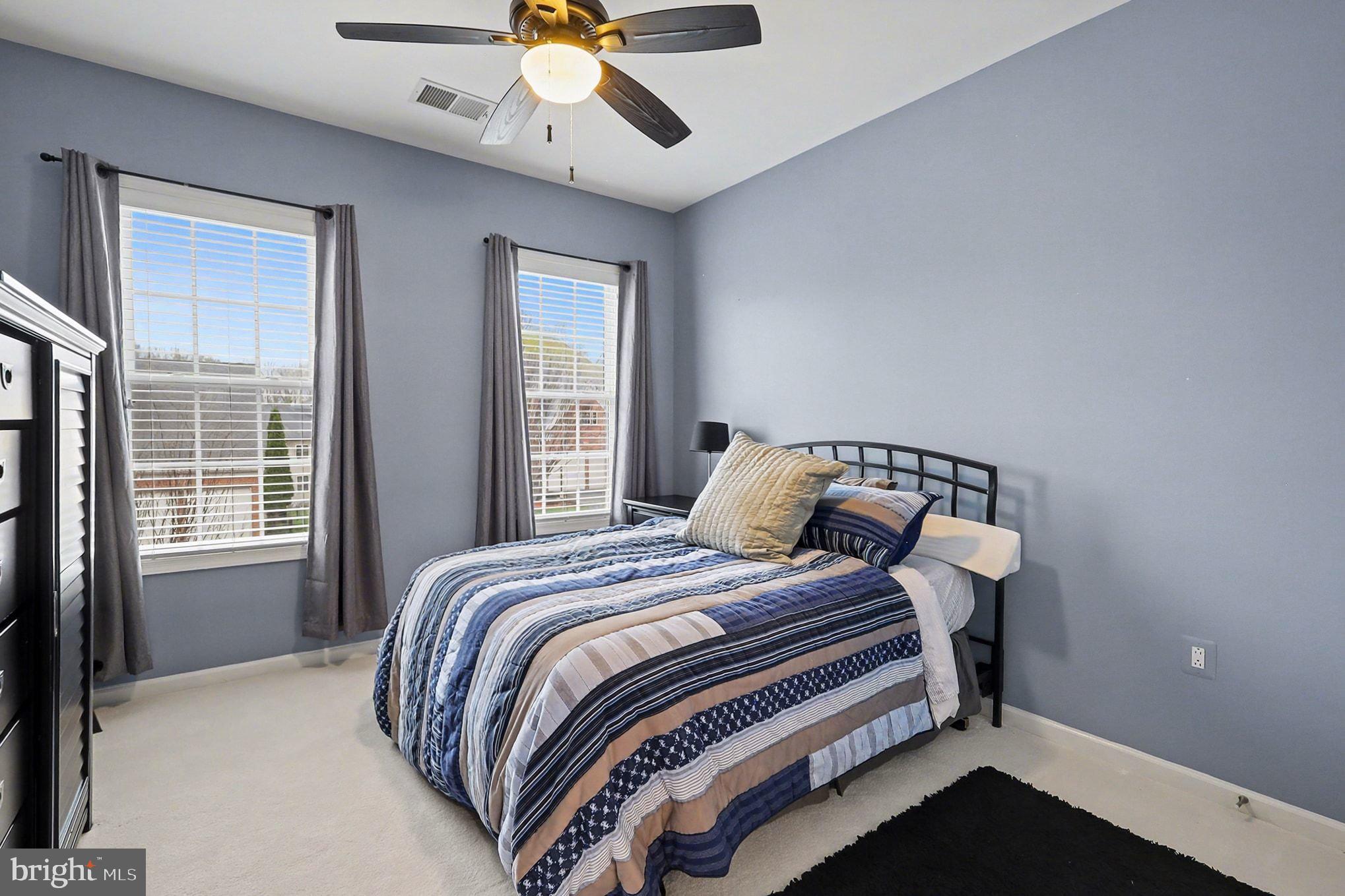 13212 Moonlight Trail Drive Silver Spring, MD 20906 - Photo 50 of 81 a bedroom with a bed and window