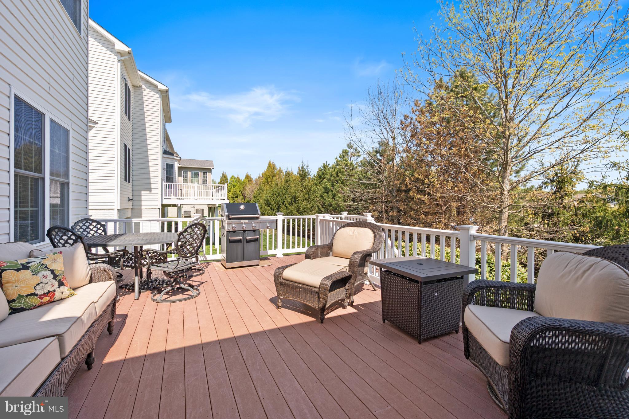 13212 Moonlight Trail Drive Silver Spring, MD 20906 - Photo 10 of 81 a view of a balcony with couch on wooden floor