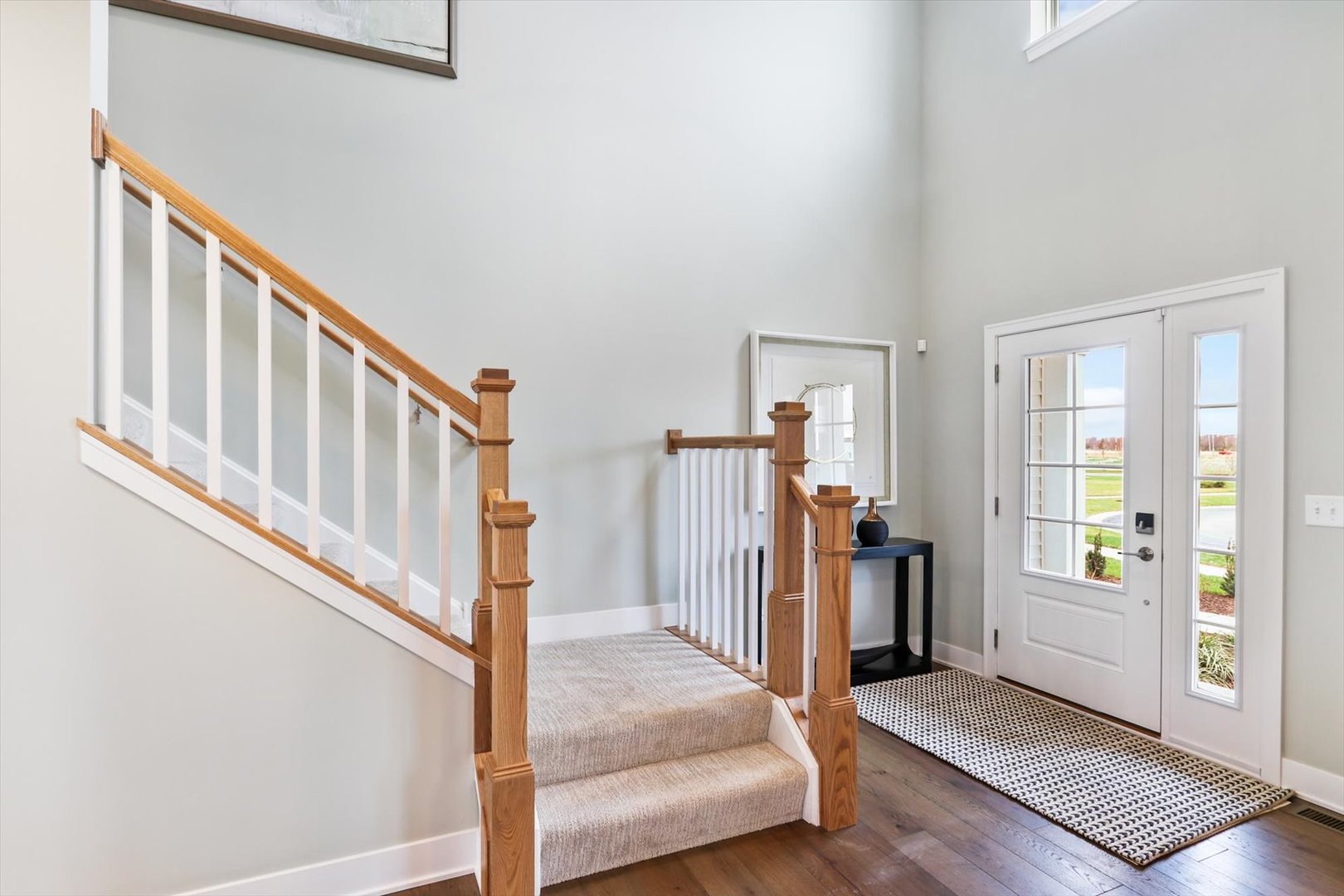 17360 Victoria Lane Lockport, IL 60441 - Photo 2 of 32 a view of a livingroom with wooden floor and stairs