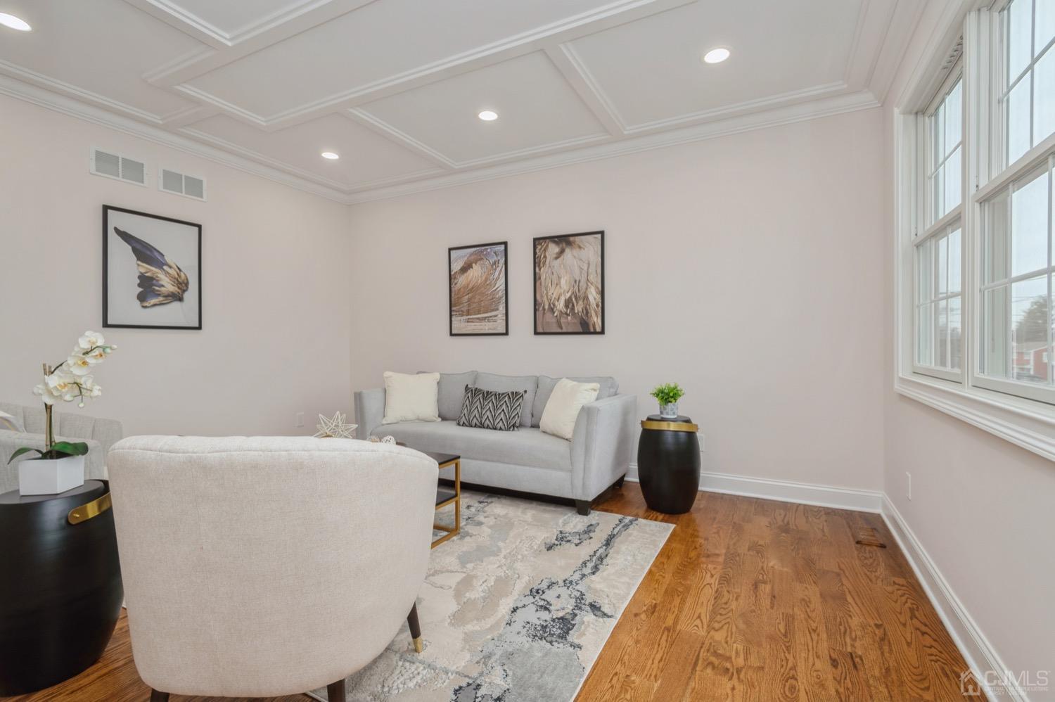 71 South Hill Road Colonia, NJ 07067 - Photo 5 of 40 a living room with furniture and wall paintings
