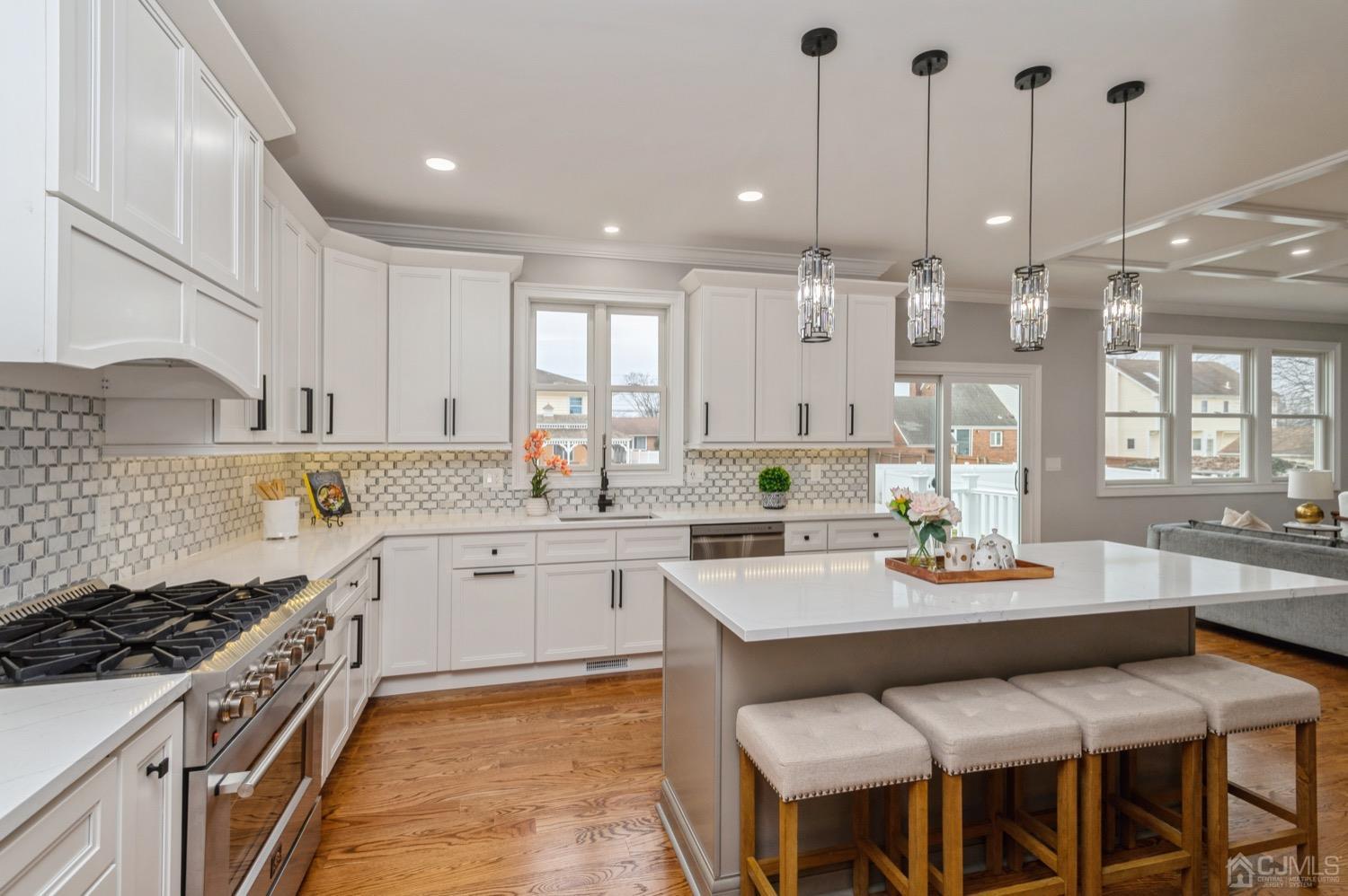 71 South Hill Road Colonia, NJ 07067 - Photo 7 of 40 a large kitchen with a table and chairs in it
