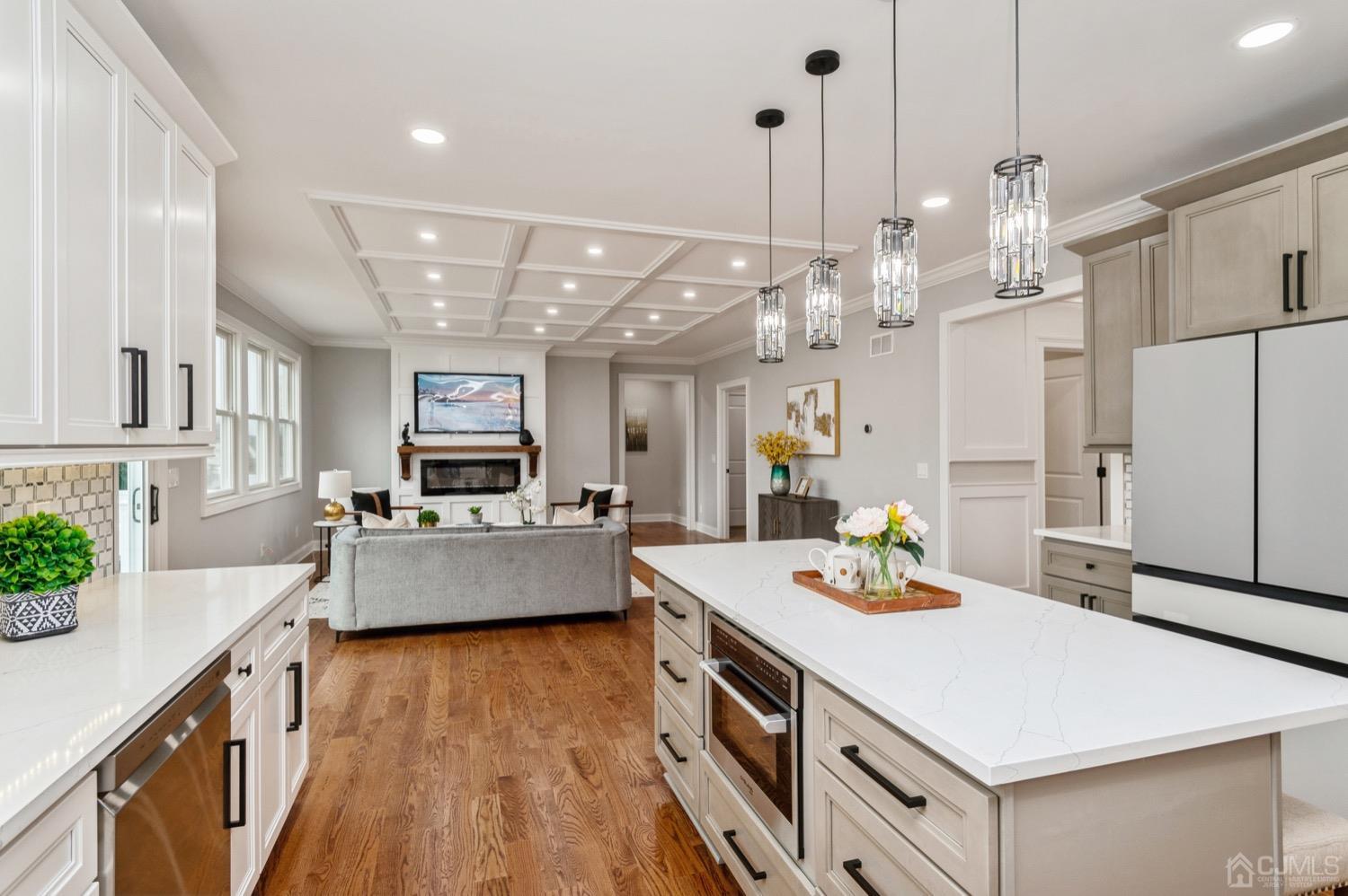 71 South Hill Road Colonia, NJ 07067 - Photo 8 of 40 a large kitchen with kitchen island a large island in it