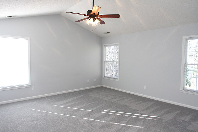 9021 Breeland Way Raleigh, NC 27613 - Photo 12 of 20 Soaring ceilings in this huge master bedrm which is tucked away from other bedrms for restful sleep and relaxation Master Suite