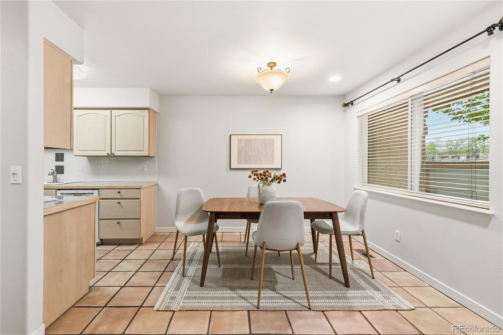 563 Ridgeview Drive Louisville, CO 80027 - Photo 11 of 33 a view of a dining room with furniture and a window