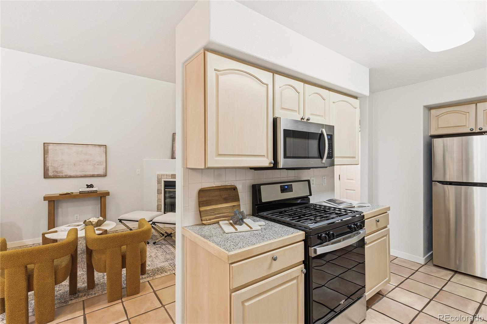 563 Ridgeview Drive Louisville, CO 80027 - Photo 13 of 33 a kitchen with a stove cabinets and microwave