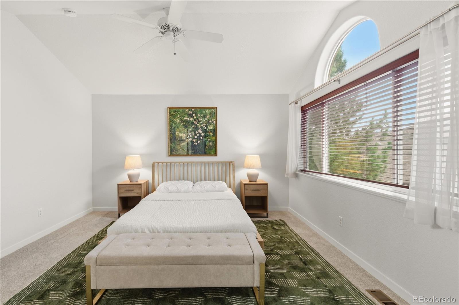 563 Ridgeview Drive Louisville, CO 80027 - Photo 20 of 33 a spacious bedroom with a bed and a window