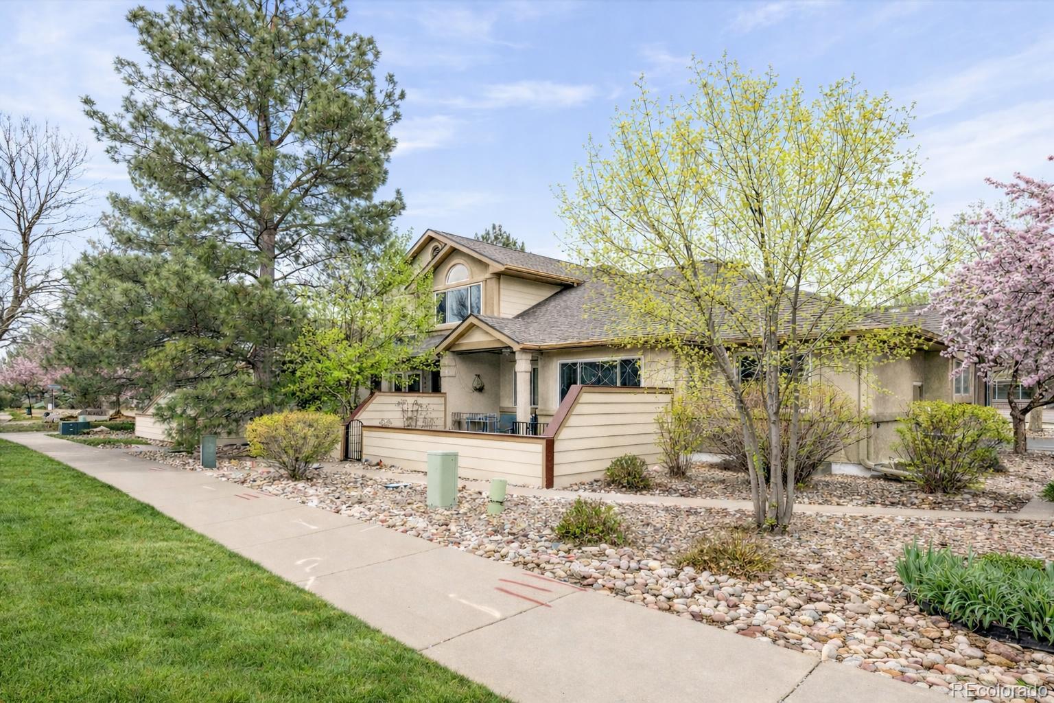 563 Ridgeview Drive Louisville, CO 80027 - Photo 2 of 33 a front view of a house with a yard and trees