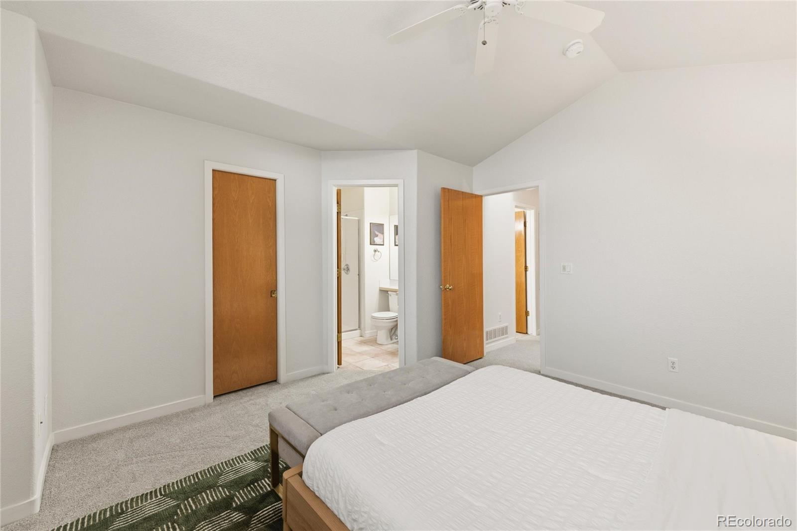 563 Ridgeview Drive Louisville, CO 80027 - Photo 21 of 33 a bedroom with a bed and a window