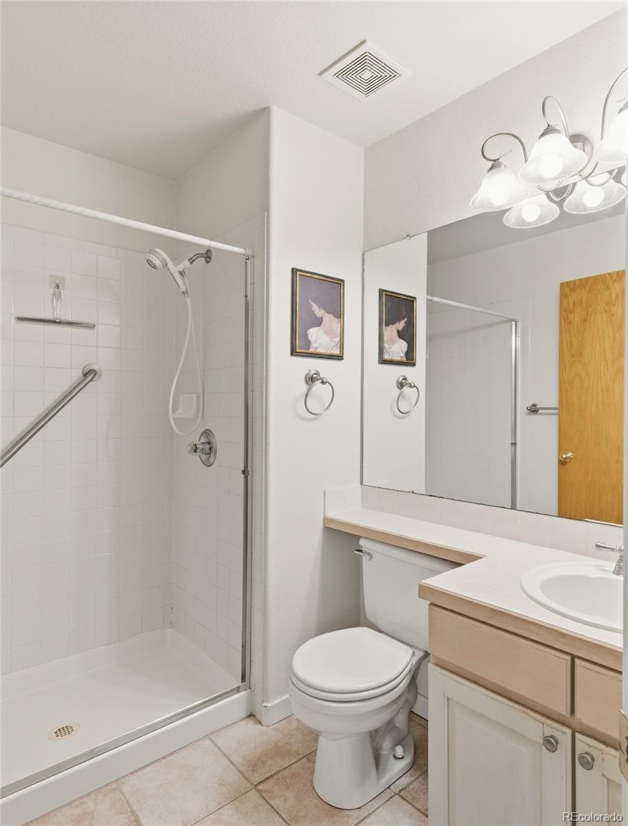 563 Ridgeview Drive Louisville, CO 80027 - Photo 22 of 33 a bathroom with a sink a toilet and shower