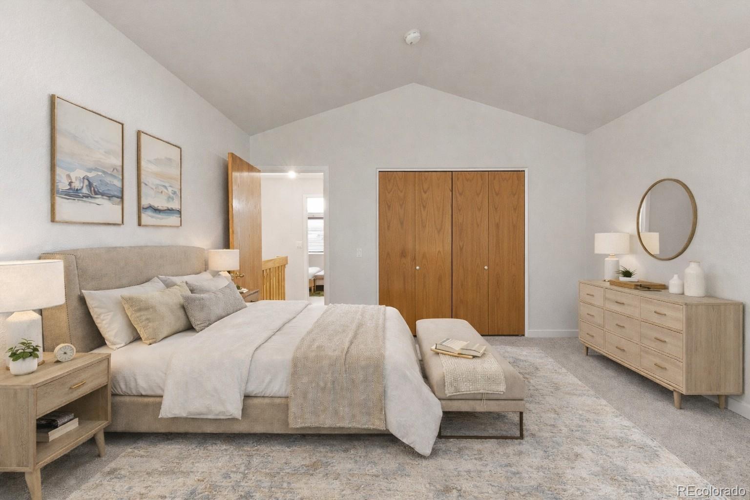 563 Ridgeview Drive Louisville, CO 80027 - Photo 25 of 33 a spacious bedroom with a bed a dresser and chair