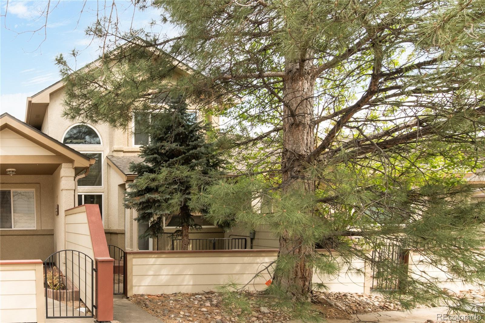 563 Ridgeview Drive Louisville, CO 80027 - Photo 3 of 33 a view of a tall building with large tree