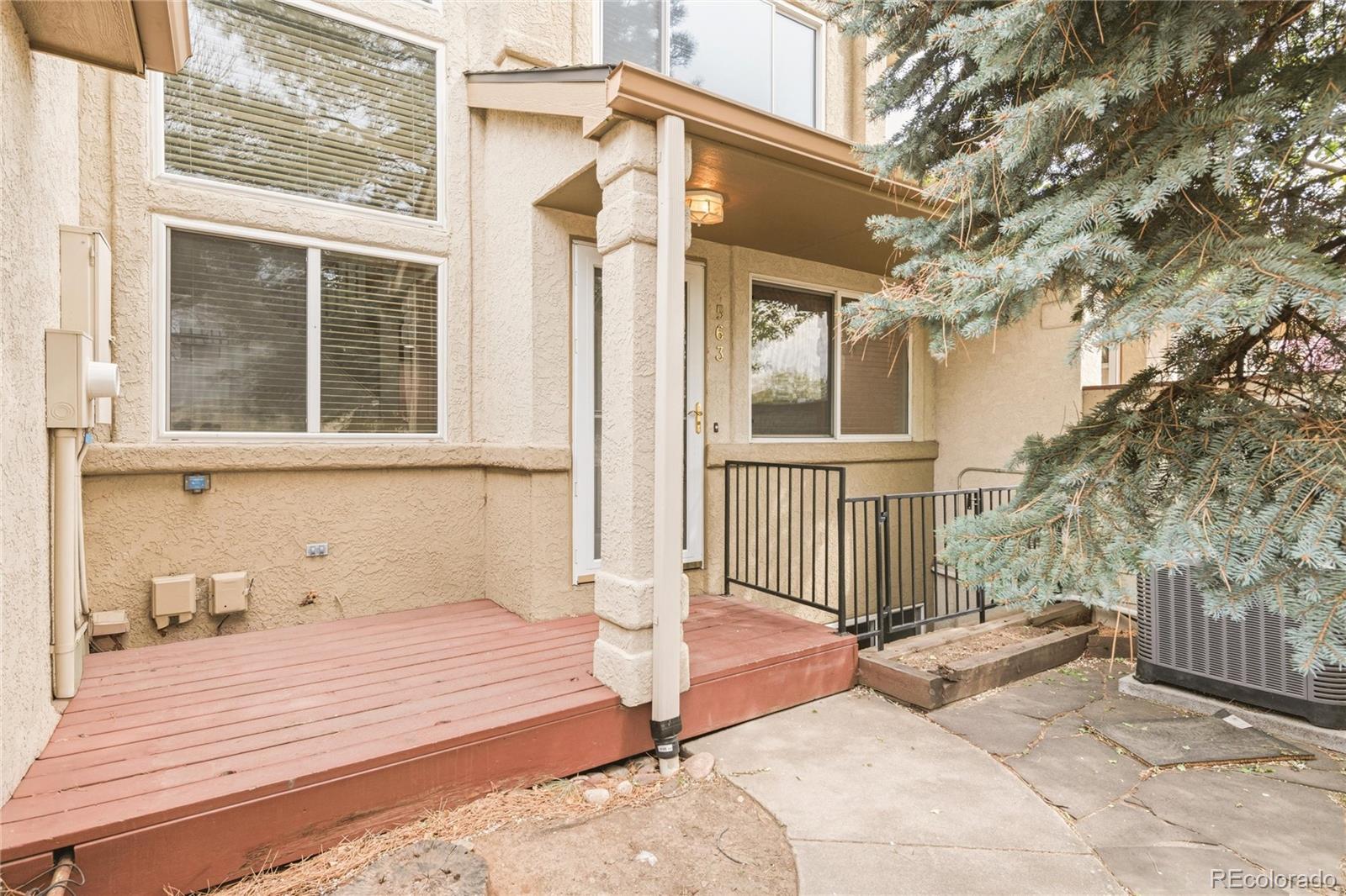 563 Ridgeview Drive Louisville, CO 80027 - Photo 4 of 33 a front view of a house with large windows