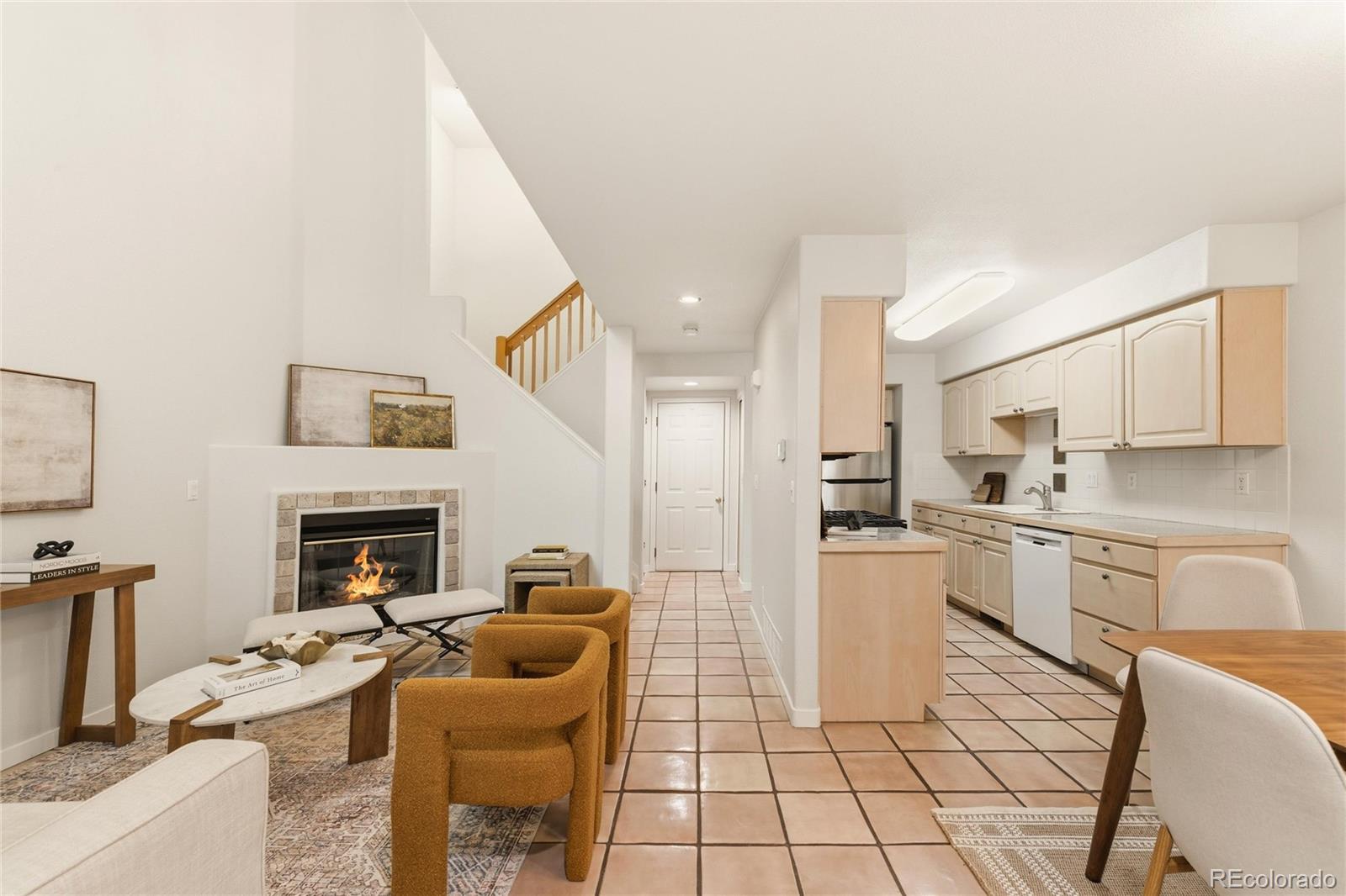 563 Ridgeview Drive Louisville, CO 80027 - Photo 5 of 33 a open kitchen with stainless steel appliances granite countertop a stove top oven a sink dishwasher and a refrigerator with the cabinets