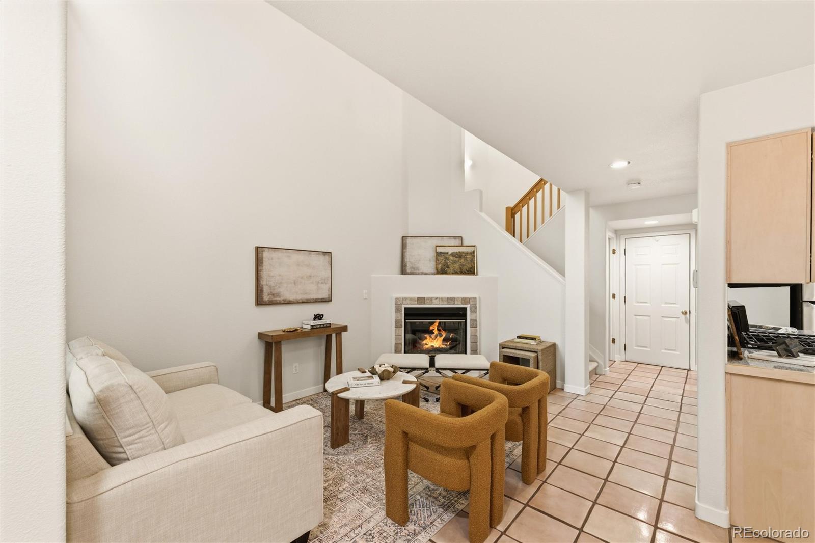 563 Ridgeview Drive Louisville, CO 80027 - Photo 6 of 33 a living room with furniture a rug and white walls