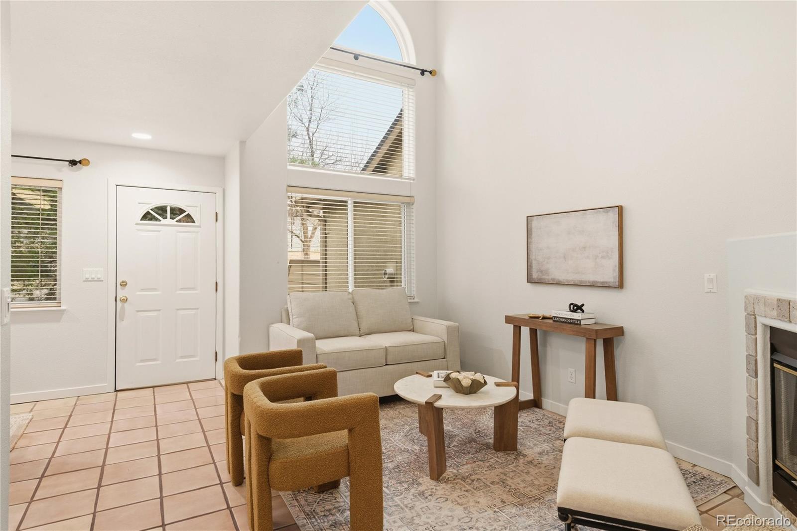 563 Ridgeview Drive Louisville, CO 80027 - Photo 8 of 33 a living room with furniture a window and a table