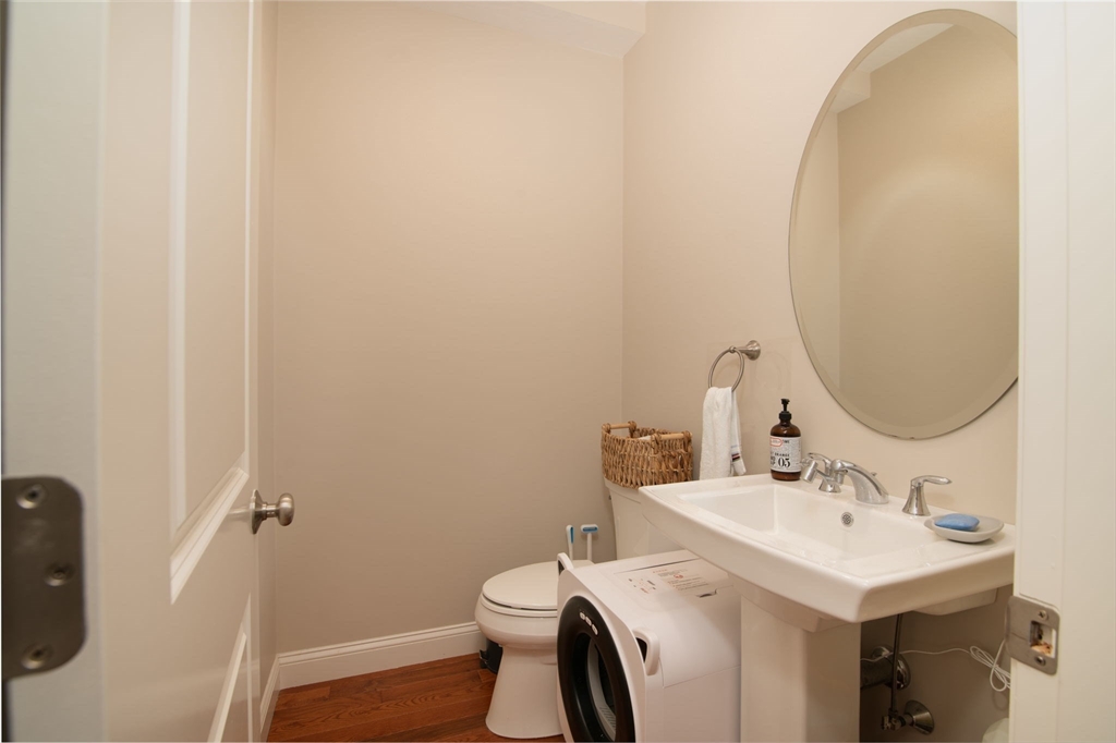 51 Tamarack Road Dracut, MA 01826 - Photo 13 of 39 a bathroom with a sink toilet and a mirror