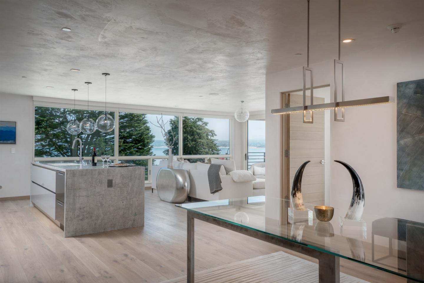 201 Cannery Row, Unit 3 Monterey, CA 93940 - Photo 11 of 19 a living room with furniture and a large window