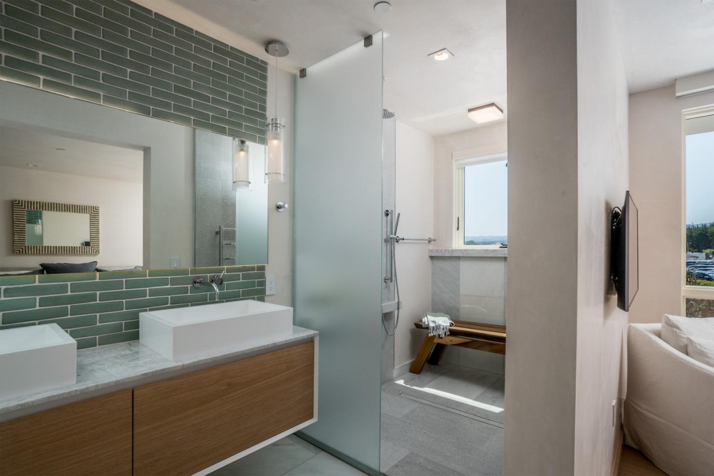 201 Cannery Row, Unit 3 Monterey, CA 93940 - Photo 13 of 19 a bathroom with a sink and a mirror
