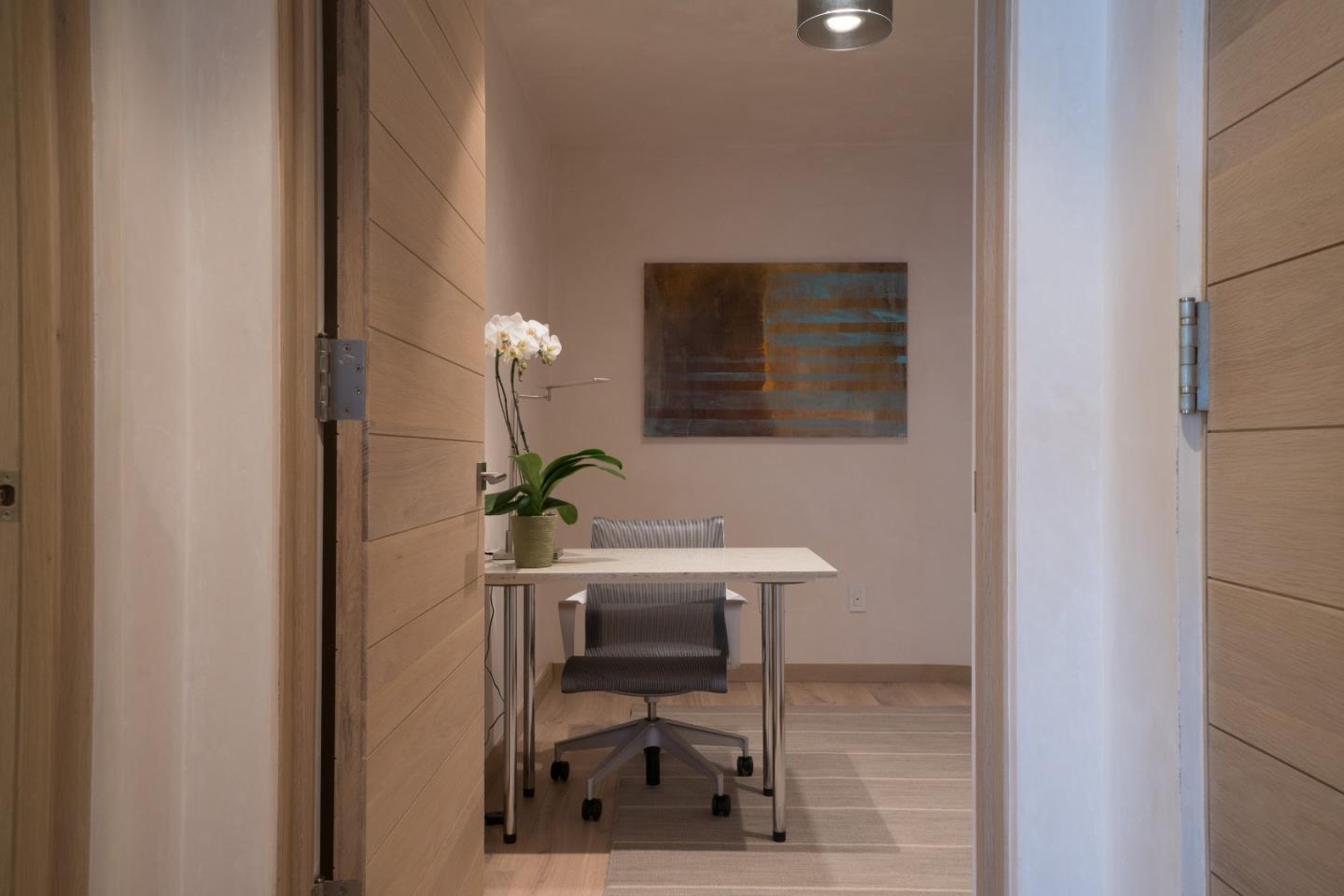 201 Cannery Row, Unit 3 Monterey, CA 93940 - Photo 17 of 19 a bathroom with a sink a mirror and a shower
