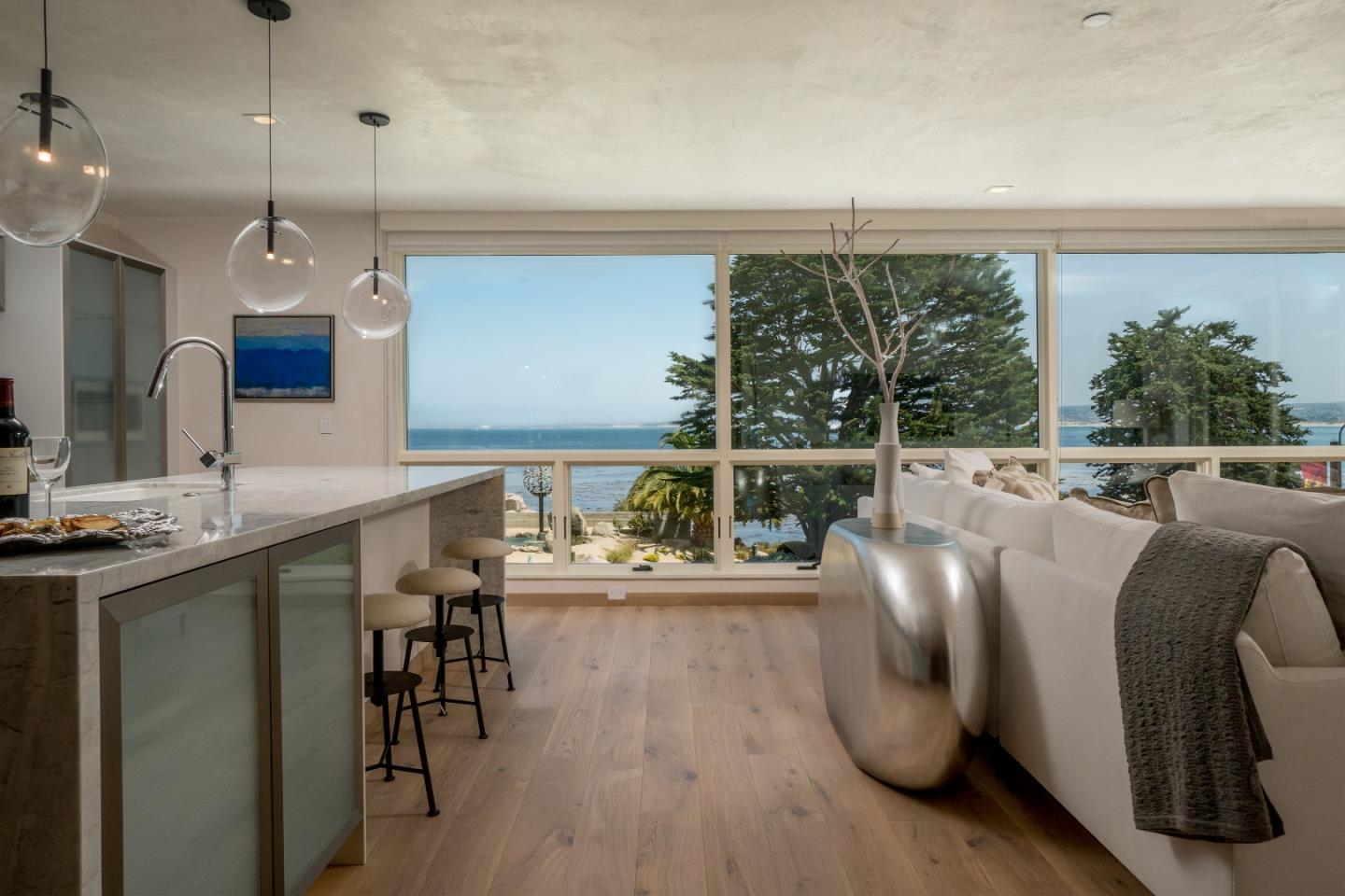201 Cannery Row, Unit 3 Monterey, CA 93940 - Photo 6 of 19 a living room with furniture a large window and a table