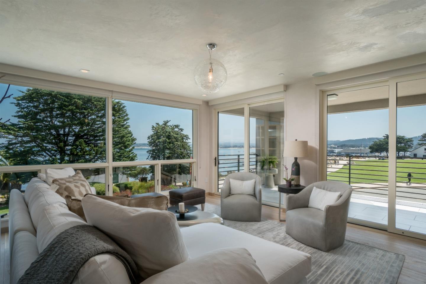 201 Cannery Row, Unit 3 Monterey, CA 93940 - Photo 7 of 19 a living room with furniture and a large window