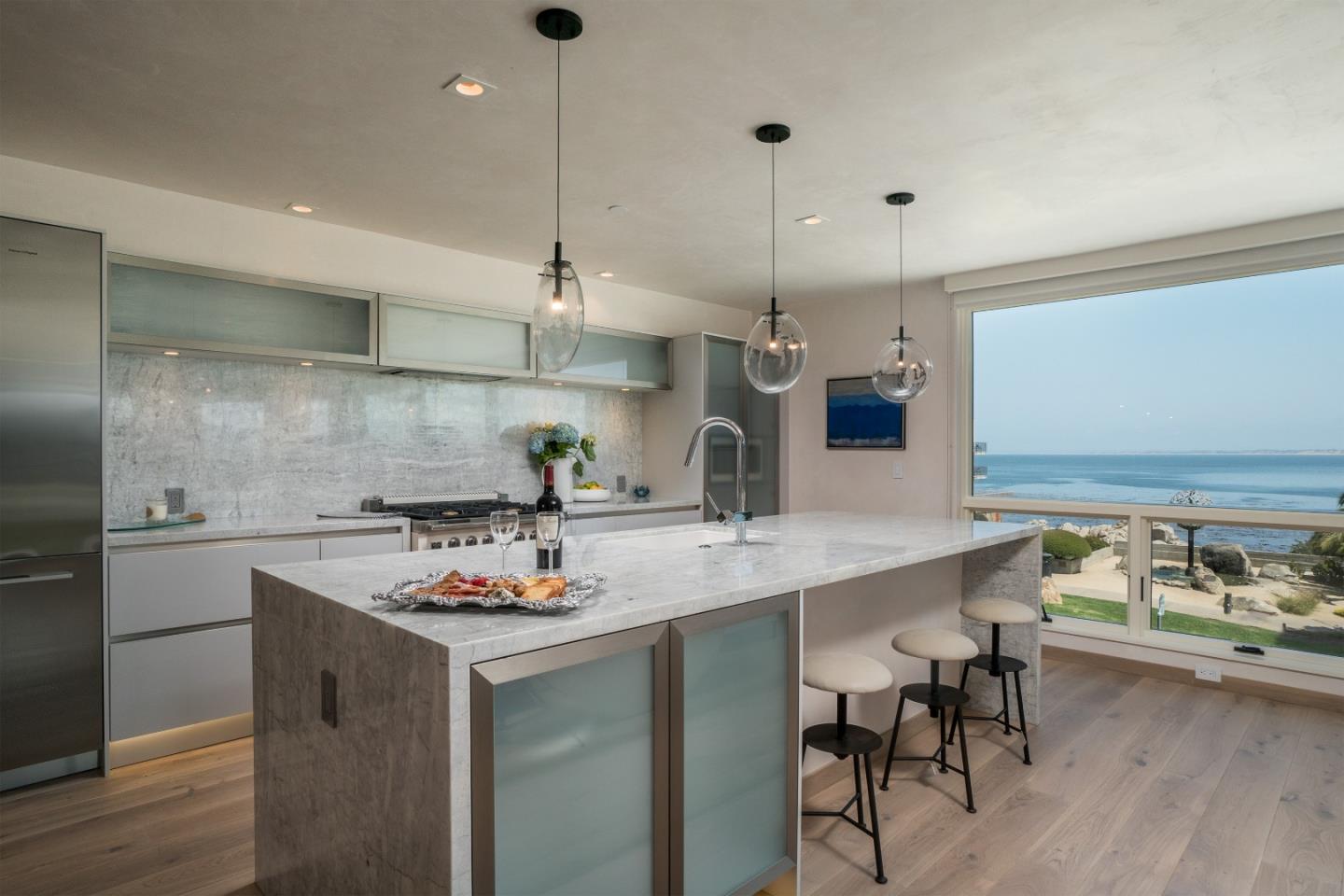 201 Cannery Row, Unit 3 Monterey, CA 93940 - Photo 8 of 19 a kitchen with a sink a counter space and stainless steel appliances