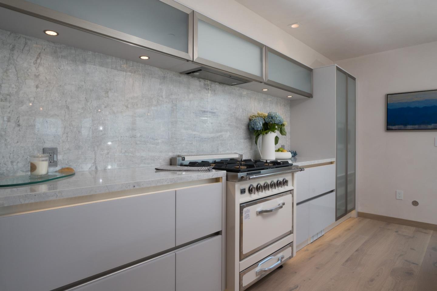 201 Cannery Row, Unit 3 Monterey, CA 93940 - Photo 9 of 19 a kitchen with stainless steel appliances a stove and a sink