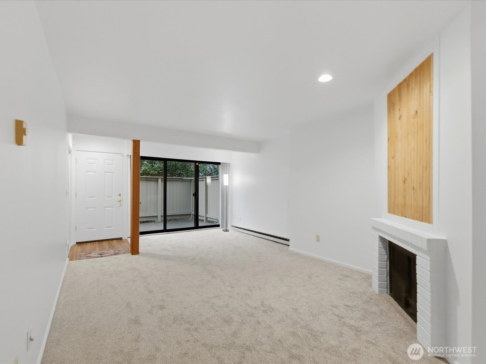 8835 166th Avenue Northeast, Unit D102 Redmond, WA 98052 - Photo 16 of 27 a view of an empty room with a fireplace and a window