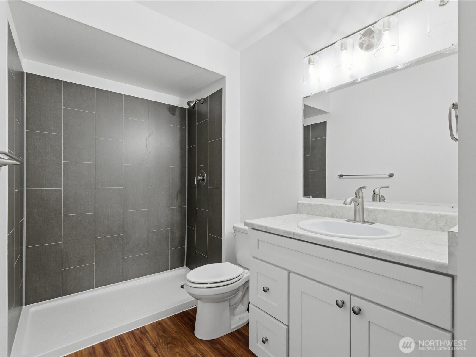 8835 166th Avenue Northeast, Unit D102 Redmond, WA 98052 - Photo 21 of 27 a bathroom with a sink a toilet and shower