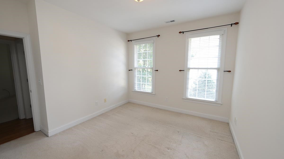 263 Waterville Street Raleigh, NC 27603 - Photo 13 of 23 Bedroom with Double Window Side Views and Walk In Closet. Main Floor Bedroom # 3