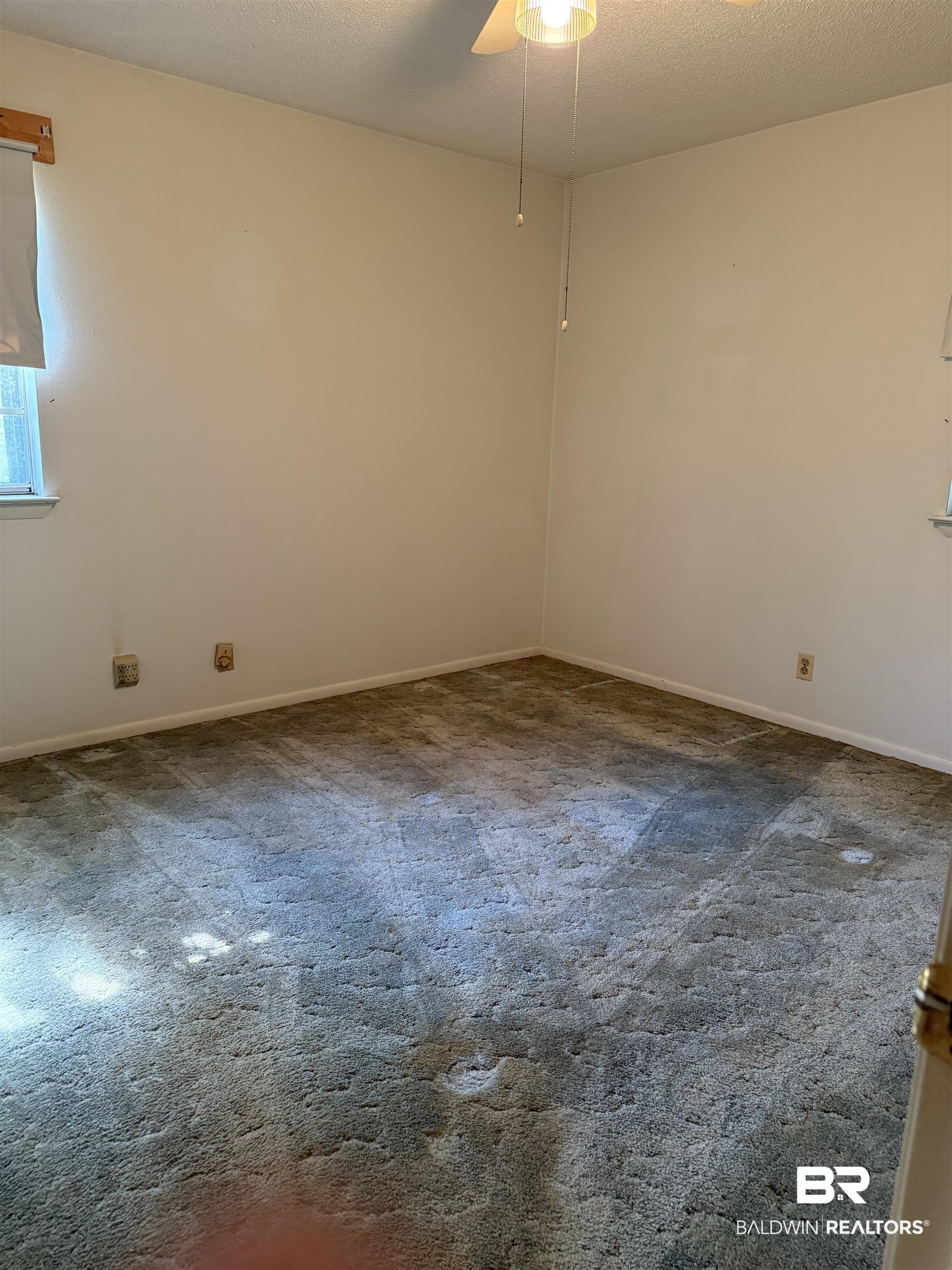 607 West Lee Street Mobile, AL 36611 - Photo 8 of 11 Empty room with carpet flooring and ceiling fan