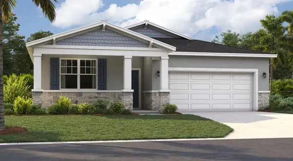 a view of a house with a small yard and plants