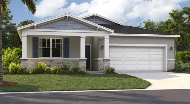 a view of a house with a small yard and plants