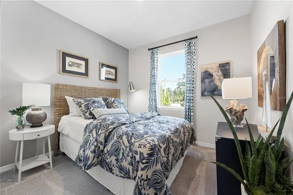 a bedroom with bed and wooden floor