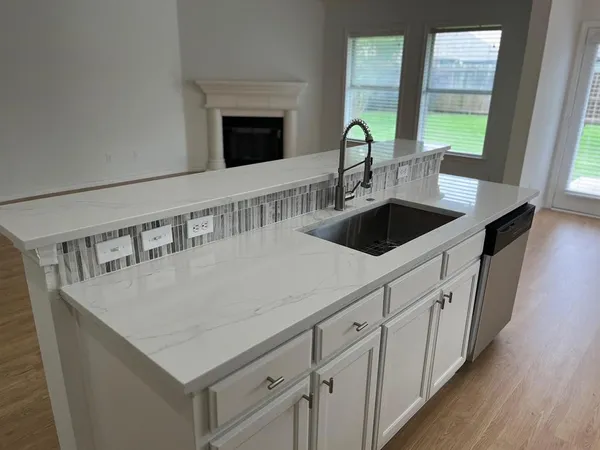 a kitchen with a sink and a window
