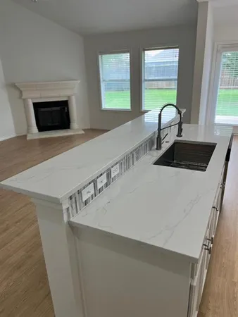 a kitchen with a two sink and a window