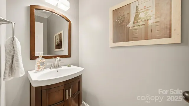 a view of a dining room with furniture wooden floor and chandelier