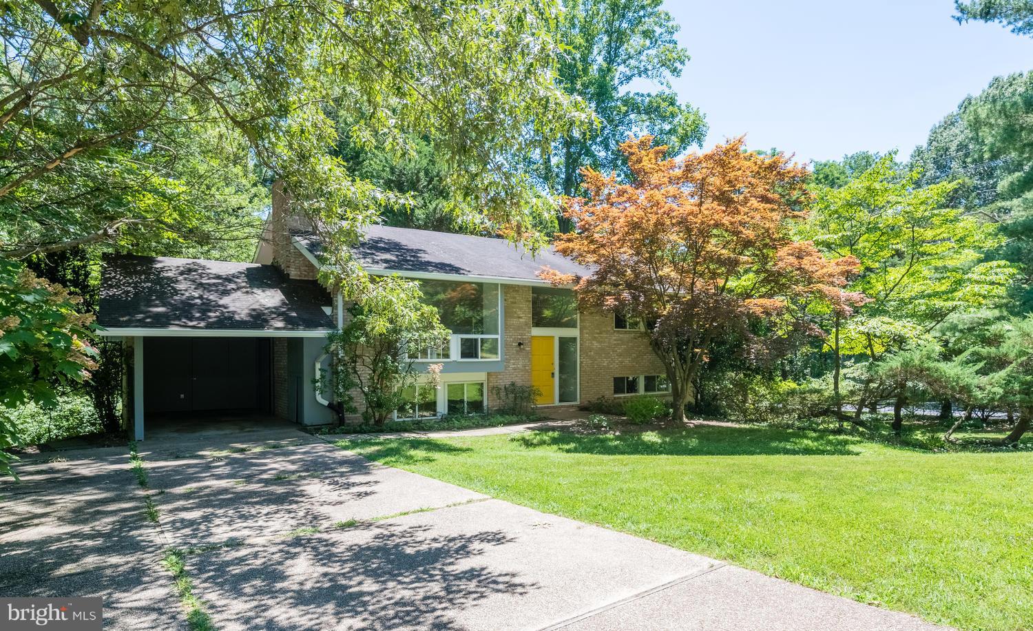 6805 Persimmon Tree Road Bethesda, MD 20817 - Photo 2 of 30 front view of a house with a yard