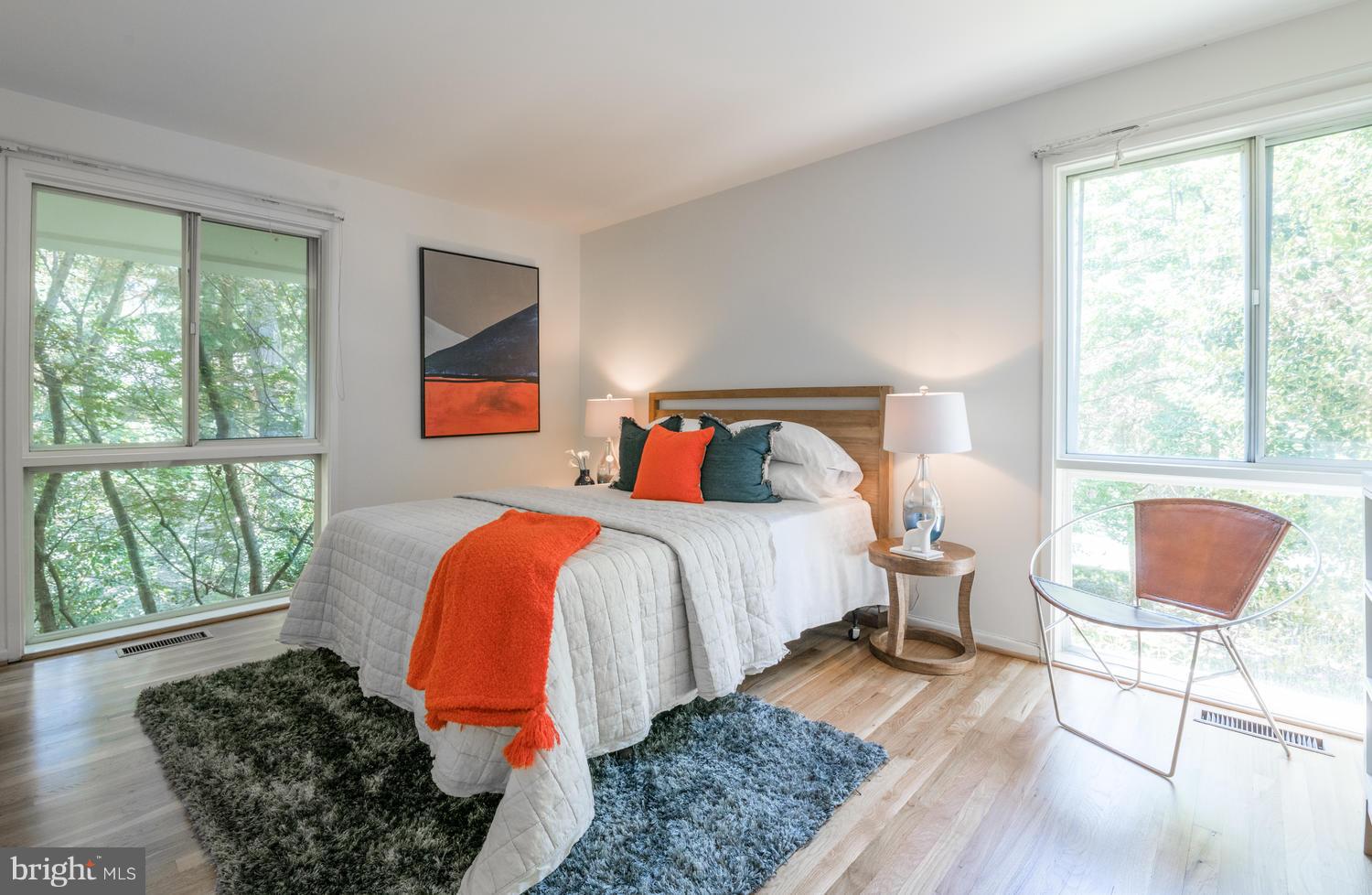 6805 Persimmon Tree Road Bethesda, MD 20817 - Photo 15 of 30 a bedroom with bed and a large window