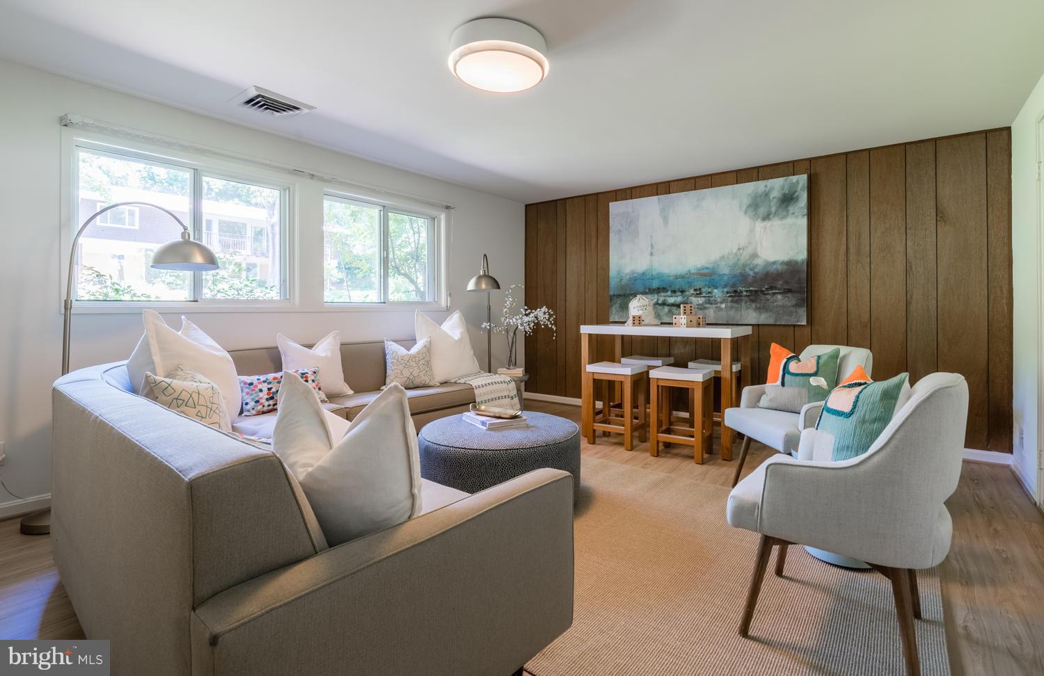6805 Persimmon Tree Road Bethesda, MD 20817 - Photo 21 of 30 a living room with furniture and a large window