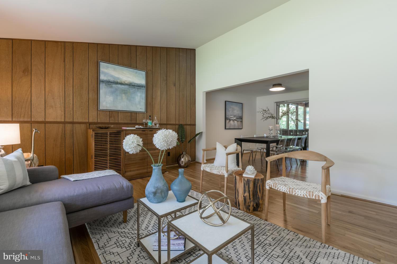 6805 Persimmon Tree Road Bethesda, MD 20817 - Photo 5 of 30 a living room with furniture and wooden floor