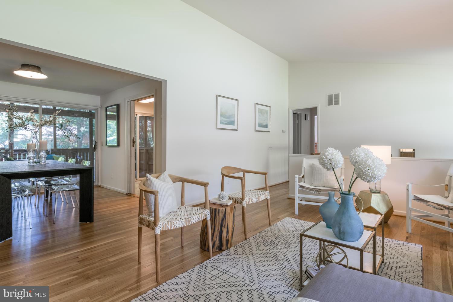 6805 Persimmon Tree Road Bethesda, MD 20817 - Photo 6 of 30 a dining room with furniture and wooden floor