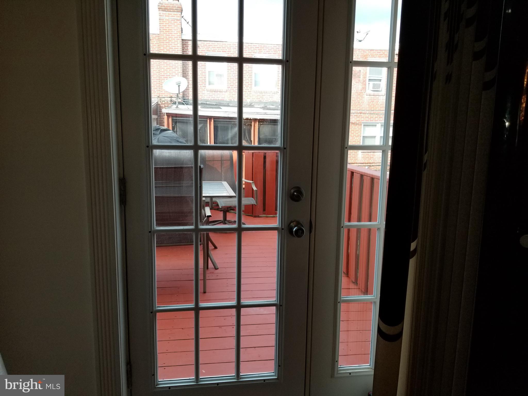 229 East Claremont Road Philadelphia, PA 19120 - Photo 25 of 66 French Doors Leading to Deck